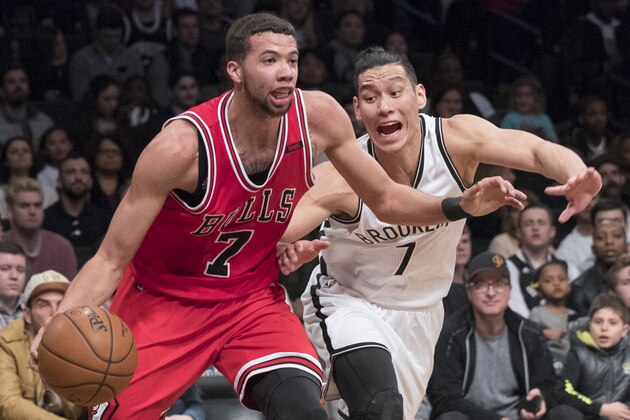 Chicago Bulls guard Michael Carter-Williams, left, drives to the basket against Brooklyn Nets guard Jeremy Lin during the second half of an NBA basketball game, Saturday, April 8, 2017, in New York. The Nets won 107-106. (AP Photo/Mary Altaffer)