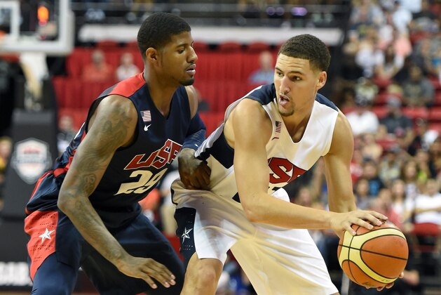 LAS VEGAS, NV - AUGUST 01:  Klay Thompson #21 of the 2014 USA Basketball Men's National Team looks to pass against Paul George #29 of the 2014 USA Basketball Men's National Team during a USA Basketball showcase at the Thomas & Mack Center on August 1, 2014 in Las Vegas, Nevada.  (Photo by Ethan Miller/Getty Images)