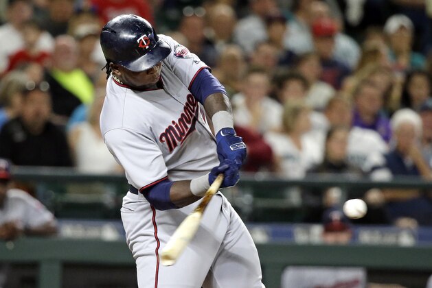 Minnesota Twins' Miguel Sano swings on a three-run home run against the Seattle Mariners during the fifth inning of a baseball game Wednesday, June 7, 2017, in Seattle. (AP Photo/Elaine Thompson)