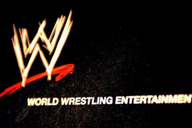 NEW YORK - MARCH 18:  The World Wrestling Entertainment logo hangs on a wall at a media conference announcing the all-star lineup of WWE WrestleMania XIX at ESPN Zone in Times Square March 18, 2003 in New York City.  (Photo by Mark Mainz/Getty Images)