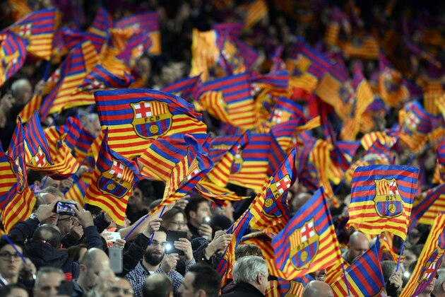 Barcelona fans wave flags before the UEFA Champions League round of 16 second leg football match FC Barcelona vs Paris Saint-Germain FC at the Camp Nou stadium in Barcelona on March 8, 2017. / AFP PHOTO / Josep LAGO        (Photo credit should read JOSEP LAGO/AFP/Getty Images)