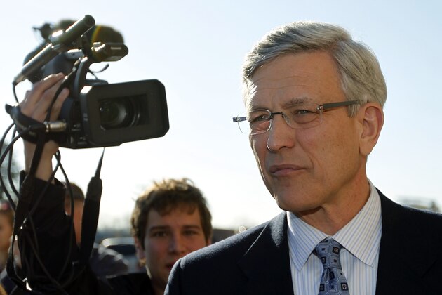 Former Penn State athletic director Tim Curley exits a district judge's office after an arraignment Monday, Nov. 7, 2011, in Harrisburg, Pa.  Curley has been charged with perjury and failure to report under Pennsylvania’s child protective services law in connection with the investigation into allegations former football defensive coordinator Jerry Sandusky sexually abused boys, the state attorney general’s office said Saturday, Nov. 5, 2011.  (AP Photo/Matt Rourke)