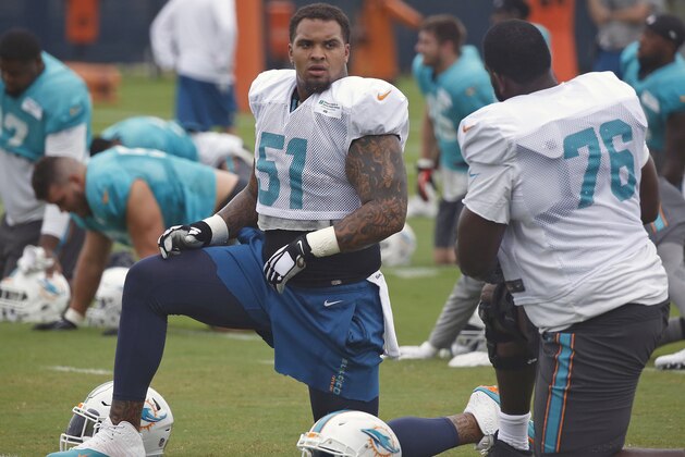 DAVIE, FL - AUGUST 8: Mike Pouncey #51 and Branden Albert #76 of the Miami Dolphins talk prior to the start of the teams training camp on August 8, 2016 at the Miami Dolphins training facility in Davie, Florida. (Photo by Joel Auerbach/Getty Images)
