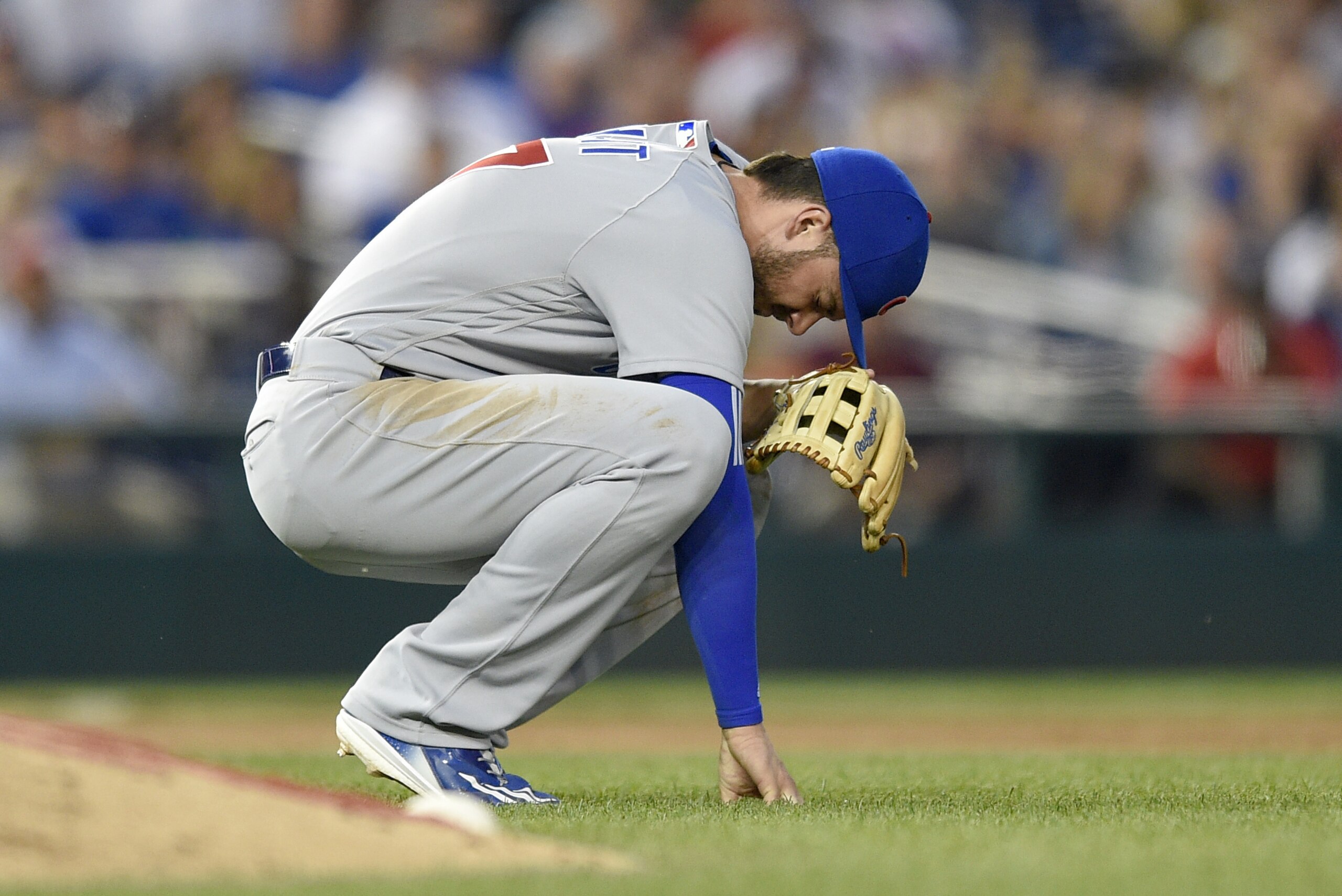 Chicago Cubs third baseman Kris Bryant pauses on the field after he made a catch on a pop-up by Washington Nationals' Matt Wieters during the fifth inning of a baseball game, Wednesday, June 28, 2017, in Washington. Bryant left the game with an injury on the play. (AP Photo/Nick Wass)
