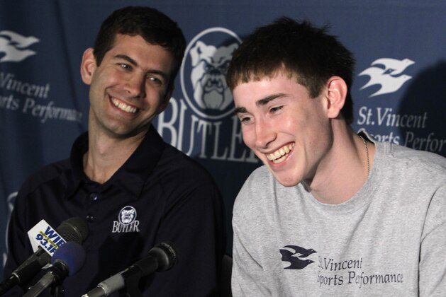 Butler guard Gordon Hayward, right, laughs along with Butler coach Brad Stevens as he announced that he will remain in the NBA draft, giving up his final two years of college basketball eligibility during a press conference in Indianapolis, Friday, May 7, 2010.  (AP Photo/Michael Conroy)