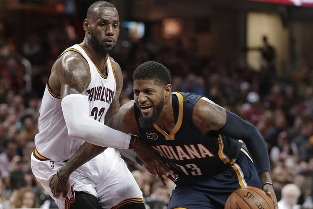 Indiana Pacers' Paul George, right, drives against Cleveland Cavaliers' LeBron James during the second half of an NBA basketball game, Sunday, April 2, 2017, in Cleveland. The Cavaliers won 135-130 in double overtime. (AP Photo/Tony Dejak)