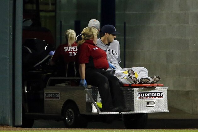 New York Yankees' Dustin Fowler is taken off the field after he was injured during the first inning of the team's baseball game against the Chicago White Sox on Thursday, June 29, 2017, in Chicago. (AP Photo/Nam Y. Huh)