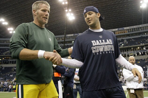 Green Bay Packers quarterback Brett Favre, left and Dallas Cowboys quarterback Tony Romo shake hands after pre-game warm up before their NFL football game, Thursday, Nov. 29, 2007, in Irving, Texas. (AP Photo/Matt Slocum)