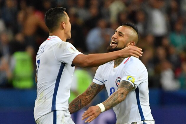 Chile's forward Alexis Sanchez and Chile's midfielder Arturo Vidal (R) celebrate after Chile won the 2017 Confederations Cup semi-final football match between Portugal and Chile at the Kazan Arena in Kazan on June 28, 2017. / AFP PHOTO / Yuri CORTEZ        (Photo credit should read YURI CORTEZ/AFP/Getty Images)