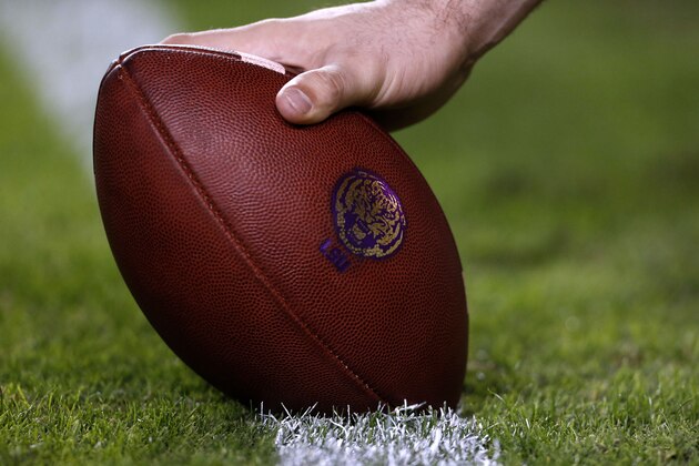 A football with an LSU logo is seen before an NCAA college football game in Baton Rouge, La., Saturday, Nov. 28, 2015. (AP Photo/Jonathan Bachman)