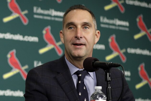 In this Friday, Dec. 9, 2016, photo, St. Louis Cardinals general manager John Mozeliak speaks during an introductory news conference announcing free agent center fielder Dexter Fowler has signed with the Cardinals in St. Louis. Mozeliak wants to avoid any notion that the Chicago Cubs winning the World Series is the driving force behind the St. Louis push to improve after missing the postseason for the first time since 2010. (AP Photo/Jeff Roberson)
