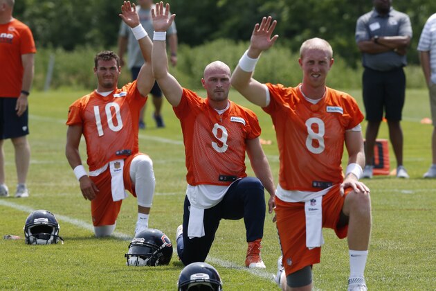 Chicago Bears quarterback Mitchell Trubisky (10), quarterback Connor Shaw (9), and quarterback Mike Glennon (8) stretch during the NFL football team's minicamp at Halas Hall, Wednesday, June 14, 2017, in Lake Forest, Ill. (AP Photo/Nam Y. Huh)