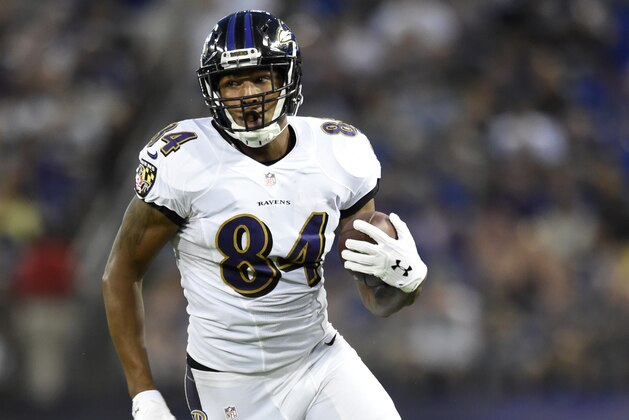 Baltimore Ravens wide receiver Darren Waller rushes the ball in the first half of a preseason NFL football game against the Detroit Lions, Saturday, Aug. 27, 2016, in Baltimore. (AP Photo/Gail Burton)