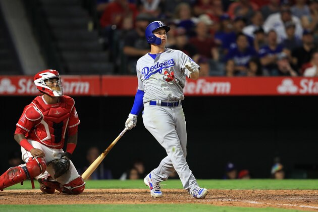 ANAHEIM, CA - JUNE 29:  Joc Pederson #31 of the Los Angeles Dodgers hits a three-run homerun during the sixt as Martin Maldonado #12 of the Los Angeles Angels of Anaheim looks on during the sixth inning of a game at Angel Stadium of Anaheim on June 29, 2017 in Anaheim, California.  (Photo by Sean M. Haffey/Getty Images)