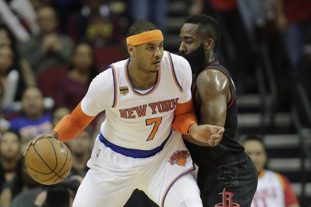 HOUSTON, TX - DECEMBER 31:  Carmelo Anthony #7 of the New York Knicks controls the ball as James Harden #13 of the Houston Rockets defends in the first half at Toyota Center on December 31, 2016 in Houston, Texas. NOTE TO USER: User expressly acknowledges and agrees that, by downloading and or using this photograph, User is consenting to the terms and conditions of the Getty Images License Agreement.  (Photo by Tim Warner/Getty Images)