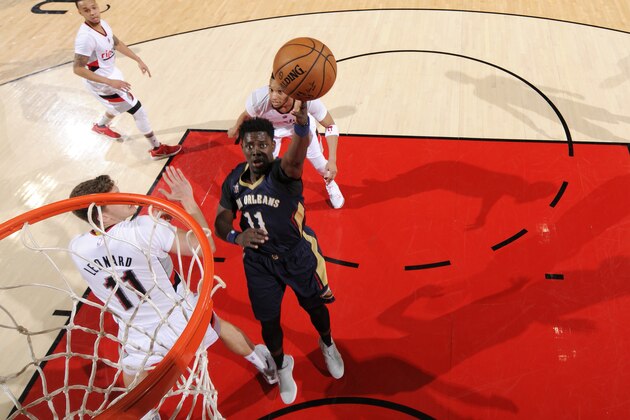 PORTLAND, OR - APRIL 12: Jrue Holiday #11 of the New Orleans Pelicans shoots the ball during the game against the Portland Trail Blazers on April 12, 2017 at the Moda Center in Portland, Oregon. NOTE TO USER: User expressly acknowledges and agrees that, by downloading and or using this Photograph, user is consenting to the terms and conditions of the Getty Images License Agreement. Mandatory Copyright Notice: Copyright 2017 NBAE (Photo by Cameron Browne/NBAE via Getty Images)