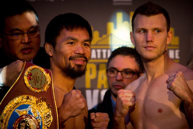 Philippine World Boxing Organization champion Manny Pacquiao (L) poses for pictures with Brisbane contender Jeff Horn (R) during the pre-fight weigh-in at Suncorp Stadium in Brisbane on July 1, 2017. 
Both boxer's will meet at a sold out Suncorp Stadium on July 2.   / AFP PHOTO / Patrick HAMILTON / -- IMAGE RESTRICTED TO EDITORIAL USE - STRICTLY NO COMMERCIAL USE --        (Photo credit should read PATRICK HAMILTON/AFP/Getty Images)