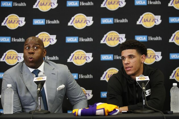 Magic Johnson, left, makes an expression as he talks about Los Angeles Lakers draft pick Lonzo Ball during the NBA basketball team's news conference, Friday, June 23, 2017, in El Segundo, Calif. (AP Photo/Jae C. Hong) Magic Johnson, left, makes an expression as he talks about Los Angeles Lakers draft pick Lonzo Ball during the NBA basketball team's news conference, Friday, June 23, 2017, in El Segundo, Calif. (AP Photo/Jae C. Hong)