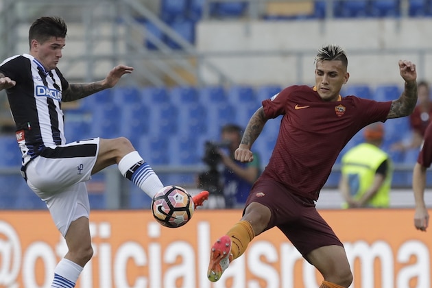Udinese's Rodrigo De Paul, left, and Roma’s Leandro Paredes go for the ball during a Serie A soccer match between Roma and Udinese, at Rome's Olympic stadium, Saturday, Aug. 20, 2016. (AP Photo/Alessandra Tarantino)
