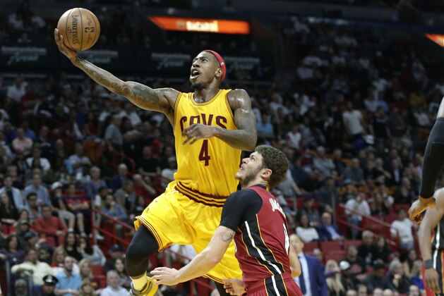 Cleveland Cavaliers' Iman Shumpert (4) drives to the basket as Miami Heat's Tyler Johnson defends during the first half of an NBA basketball game, Saturday, March 4, 2017, in Miami. (AP Photo/Lynne Sladky) Cleveland Cavaliers' Iman Shumpert (4) drives to the basket as Miami Heat's Tyler Johnson defends during the first half of an NBA basketball game, Saturday, March 4, 2017, in Miami. (AP Photo/Lynne Sladky)