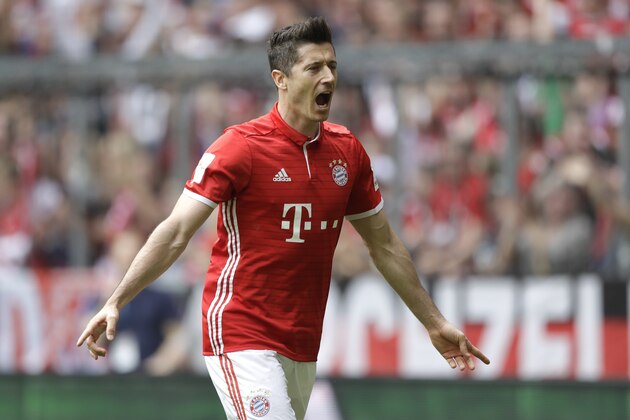 Bayern's Robert Lewandowski celebrates after scoring his side's opening goal during the German  Bundesliga  soccer match between FC Bayern Munich and FC Augsburg at the Allianz Arena stadium in Munich, Germany, Saturday, April 1, 2017. (AP Photo/Matthias Schrader)