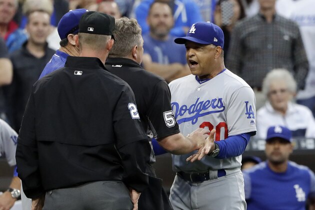 Los Angeles Dodgers manager Dave Roberts, right, speaks to home plate umpire Greg Gibson after an argument during the second inning of the team's baseball game against the San Diego Padres on Friday, June 30, 2017, in San Diego. (AP Photo/Gregory Bull) Los Angeles Dodgers manager Dave Roberts, right, speaks to home plate umpire Greg Gibson after an argument during the second inning of the team's baseball game against the San Diego Padres on Friday, June 30, 2017, in San Diego. (AP Photo/Gregory Bull)