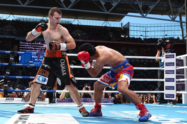 BRISBANE, AUSTRALIA - JULY 02:  Jeff Horn of Australia and Manny Pacquiao exchange punches during the WBO World Welterweight Title Fight  at Suncorp Stadium on July 2, 2017 in Brisbane, Australia.  (Photo by Chris Hyde/Getty Images)