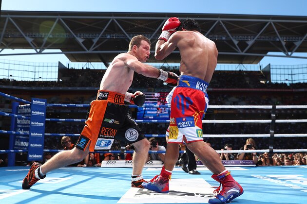 BRISBANE, AUSTRALIA - JULY 02:  Jeff Horn of Australia and Manny Pacquiao exchange punches during the WBO World Welterweight Title Fight  at Suncorp Stadium on July 2, 2017 in Brisbane, Australia.  (Photo by Chris Hyde/Getty Images)