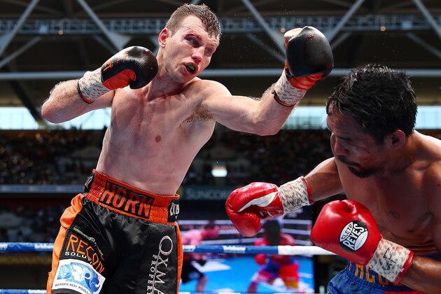 BRISBANE, AUSTRALIA - JULY 02:  Jeff Horn of Australia punches Manny Pacquiao during the WBO World Welterweight Title Fight at Suncorp Stadium on July 2, 2017 in Brisbane, Australia.  (Photo by Chris Hyde/Getty Images)