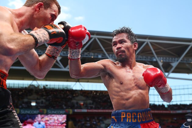BRISBANE, AUSTRALIA - JULY 02:  Manny Pacquiao of the Philippines punches Jeff Horn of Australia during the WBO World Welterweight Title Fight  at Suncorp Stadium on July 2, 2017 in Brisbane, Australia.  (Photo by Chris Hyde/Getty Images)