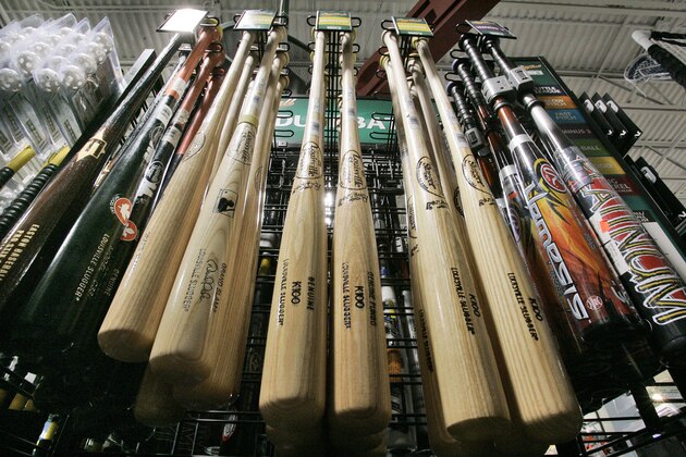 ** ADVANCE FOR WEEKEND, JUNE 30 - JULY 1 ** A display of wooden, left, and aluminum, right, baseball bats hangs in a sporting goods store in Robinson Township, Pa., Tuesday, June 26, 2007. A small but vocal contingent of lawmakers, coaches, and parents are trying to ban the use of metal bats in youth baseball games. (AP Photo/Gene J. Puskar) ** ADVANCE FOR WEEKEND, JUNE 30 - JULY 1 ** A display of wooden, left, and aluminum, right, baseball bats hangs in a sporting goods store in Robinson Township, Pa., Tuesday, June 26, 2007. A small but vocal contingent of lawmakers, coaches, and parents are trying to ban the use of metal bats in youth baseball games. (AP Photo/Gene J. Puskar)