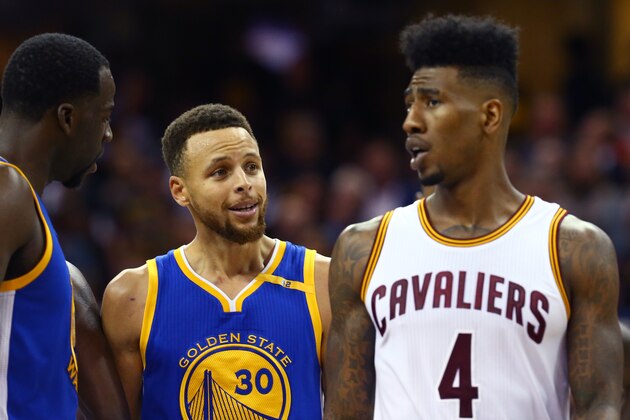 CLEVELAND, OH - JUNE 07:  Stephen Curry #30 of the Golden State Warriors and Iman Shumpert #4 of the Cleveland Cavaliers speak in the second quarter in Game 3 of the 2017 NBA Finals at Quicken Loans Arena on June 7, 2017 in Cleveland, Ohio. NOTE TO USER: User expressly acknowledges and agrees that, by downloading and or using this photograph, User is consenting to the terms and conditions of the Getty Images License Agreement.  (Photo by Ronald Martinez/Getty Images)