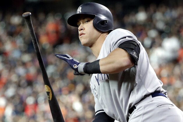 New York Yankees' Aaron Judge tosses his bat after walking during the first inning of a baseball game against the Houston Astros,  Friday, June 30, 2017, in Houston. (AP Photo/David J. Phillip)