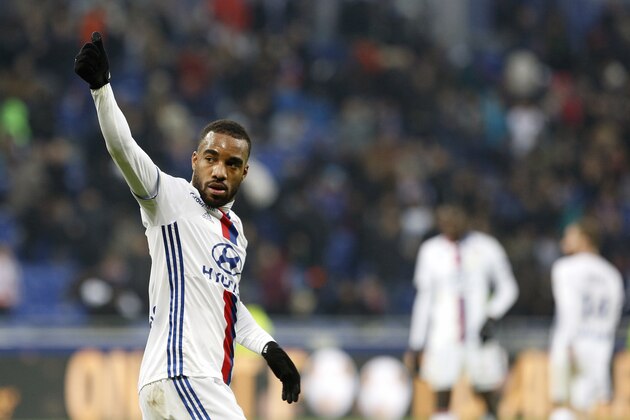 Lyon's Alexandre Lacazette celebrates after they won their French League One soccer match against Paris Saint Germain in Decines, near Lyon, central France, Sunday, Nov. 27, 2016. (AP Photo/Laurent Cipriani)