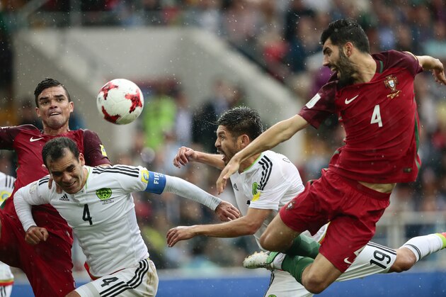 From right, Portugal's Luis Neto, Mexico's Oribe Peralta, Mexico's Rafael Marquez and Portugal's Pepe go for the ball during the Confederations Cup, third place soccer match between Portugal and Mexico, at the Moscow Spartak Stadium, Sunday, July 2, 2017. (AP Photo/Denis Tyrin)