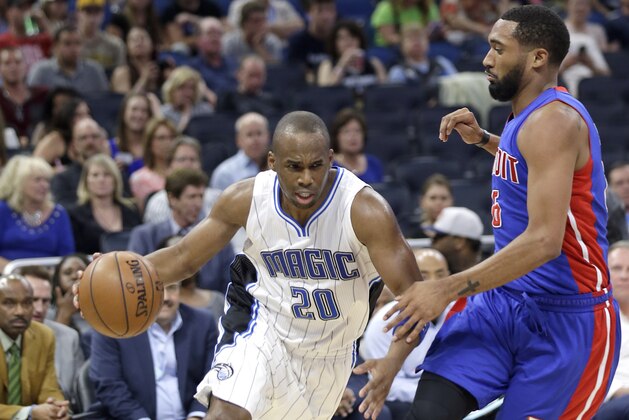 Orlando Magic's Jodie Meeks (20) makes a move to get past Detroit Pistons' Darrun Hilliard during the second half of an NBA basketball game, Friday, March 24, 2017, in Orlando, Fla. Orlando won 115-87. (AP Photo/John Raoux)