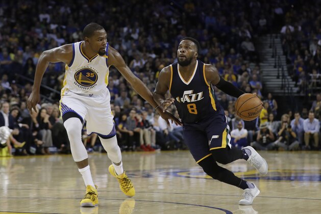 Utah Jazz guard Shelvin Mack (8) is defended by Golden State Warriors forward Kevin Durant (35) during the second half of an NBA basketball game Monday, April 10, 2017, in Oakland, Calif. (AP Photo/Marcio Jose Sanchez)