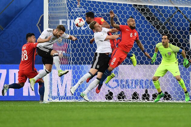Germany's defender Jonas Hector (L) and Germany's defender Matthias Ginter vie with Chile's midfielder Arturo Vidal (C) during the 2017 Confederations Cup final football match between Chile and Germany at the Saint Petersburg Stadium in Saint Petersburg on July 2, 2017. / AFP PHOTO / FRANCK FIFE        (Photo credit should read FRANCK FIFE/AFP/Getty Images)