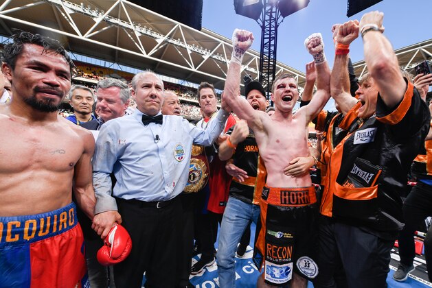 BRISBANE, AUSTRALIA - JULY 2: Jeff Horn (2nd R) of Australia celebrates beating Manny Pacquiao (L) of the Philippines in their WBO welterweight championship title fight at Suncorp Stadium on July 2, 2017 in Brisbane, Australia.  (Photo by Bradley Kanaris/Getty Images)