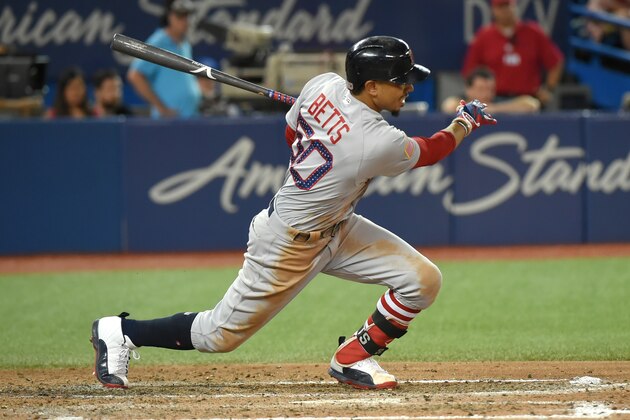 Jul 2, 2017; Toronto, Ontario, CAN;   Boston Red Sox right fielder Mookie Betts (50) hits a single to drive in two runs against Toronto Blue Jays in the seventh inning at Rogers Centre. Mandatory Credit: Dan Hamilton-USA TODAY Sports