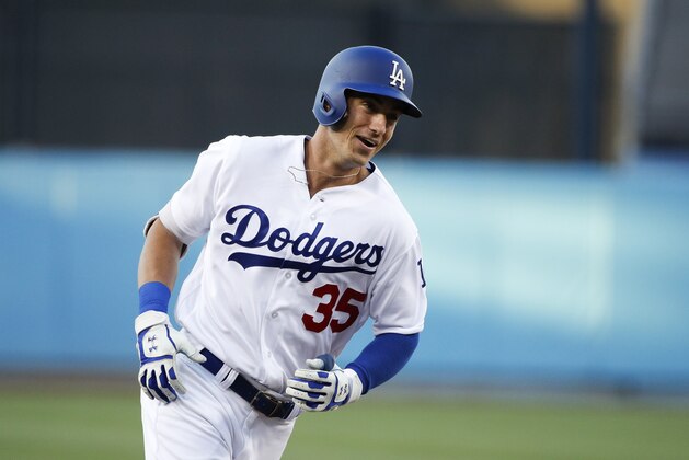Los Angeles Dodgers' Cody Bellinger smiles as he rounds the bases after hitting a two-run home run during the first inning of the team's baseball game against the New York Mets, Tuesday, June 20, 2017, in Los Angeles. (AP Photo/Jae C. Hong)