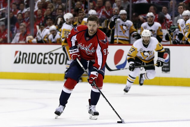 Washington Capitals center Evgeny Kuznetsov (92), from Russia, skates with the puck after loosing his helmet during the second period of Game 7 in an NHL hockey Stanley Cup Eastern Conference semifinal against the Pittsburgh Penguins, Wednesday, May 10, 2017, in Washington. (AP Photo/Alex Brandon)
