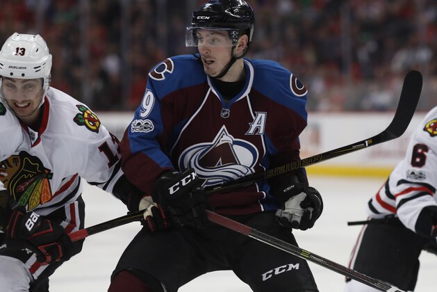 Chicago Blackhawks left wing Tomas Jurco (13) and Colorado Avalanche center Matt Duchene (9) in the third period of an NHL hockey game Tuesday, April 4, 2017, in Denver. The Avalanche won 4-3 in overtime. (AP Photo/David Zalubowski)