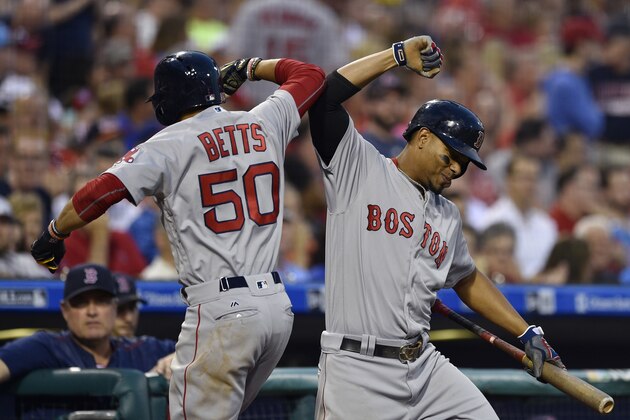 Boston Red Sox's Mookie Betts (50) celebrates with Xander Bogaerts after Betts hit a solo home run off Philadelphia Phillies' Jeremy Hellickson during the fourth inning of a baseball game, Wednesday, June 14, 2017, in Philadelphia. (AP Photo/Derik Hamilton)