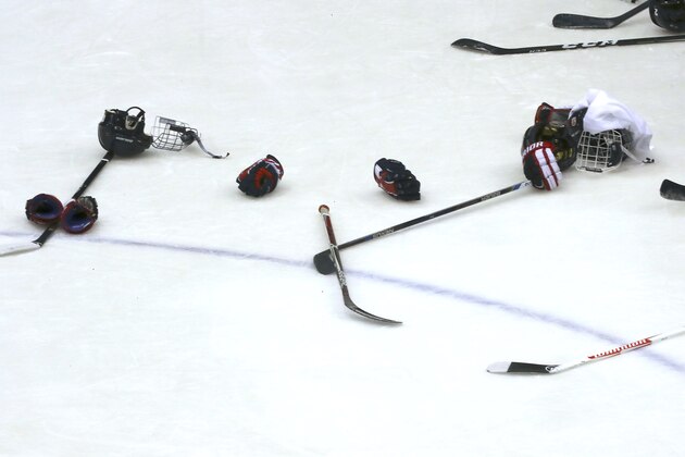 Equipments used by the Japanese women's national ice hockey team members are placed on the ice rink as they pose for their group photo after the practice session for the Asian Winter Games at Tsukisamu Gymnasium in Sapporo, northern Japan, Friday, Feb. 17, 2017. With the Winter Olympics just a year and a short distance away, the Asian Winter Games will be the ideal stage for the continent's leading winter athletes to fine tune for Pyeongchang 2018. The eighth Asian Winter Games will open Sunday in Sapporo,and run through Feb. 26, with more than 2,000 athletes from 31 countries competing in five sports, 11 disciplines and 64 events. (AP Photo/Eugene Hoshiko) Equipments used by the Japanese women's national ice hockey team members are placed on the ice rink as they pose for their group photo after the practice session for the Asian Winter Games at Tsukisamu Gymnasium in Sapporo, northern Japan, Friday, Feb. 17, 2017. With the Winter Olympics just a year and a short distance away, the Asian Winter Games will be the ideal stage for the continent's leading winter athletes to fine tune for Pyeongchang 2018. The eighth Asian Winter Games will open Sunday in Sapporo,and run through Feb. 26, with more than 2,000 athletes from 31 countries competing in five sports, 11 disciplines and 64 events. (AP Photo/Eugene Hoshiko)