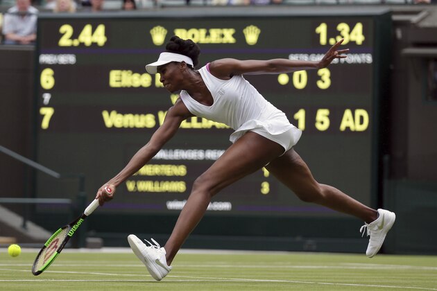 Venus Williams of the United States returns to Belgium's Elise Mertens during their Women's Singles Match on day one at the Wimbledon Tennis Championships in London Monday, July 3, 2017. (AP Photo/Tim Ireland)