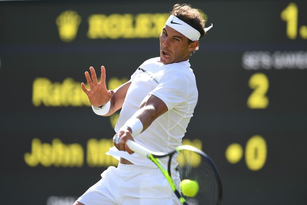 Spain's Rafael Nadal returns against Australia's John Millman during their men's singles first round match on the first day of the 2017 Wimbledon Championships at The All England Lawn Tennis Club in Wimbledon, southwest London, on July 3, 2017. / AFP PHOTO / Glyn KIRK / RESTRICTED TO EDITORIAL USE        (Photo credit should read GLYN KIRK/AFP/Getty Images)
