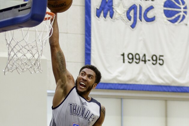 Oklahoma City Thunder's Josh Huestis (34) dunks over New York Knicks' Luke Kornet during the second half of an NBA summer league basketball game, Monday, July 3, 2017, in Orlando, Fla. (AP Photo/John Raoux)