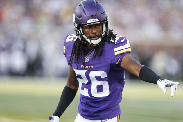 Minnesota Vikings cornerback Trae Waynes (26) signals against the Tampa Bay Buccaneers in the first half of a preseason NFL football game at TCF Bank Stadium Saturday, Aug. 15, 2015, in Minneapolis. (AP Photo/Jim Mone)