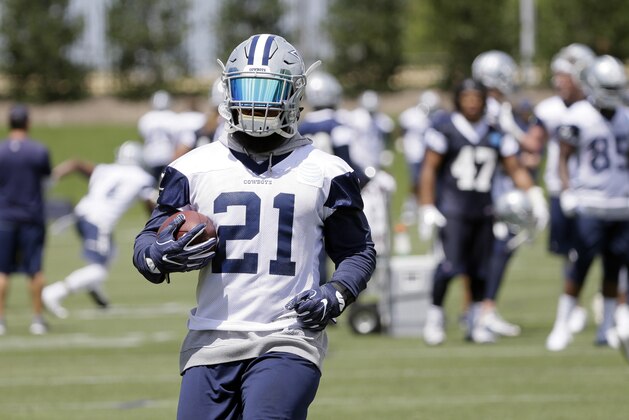 Dallas Cowboys running back Ezekiel Elliott runs the ball during an NFL football practice at the team's training facility, Tuesday, June 13, 2017, in Frisco, Texas. (AP Photo/Tony Gutierrez)